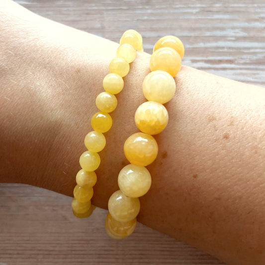 Håndlavet krystal armbånd med gul honey calcit perler.